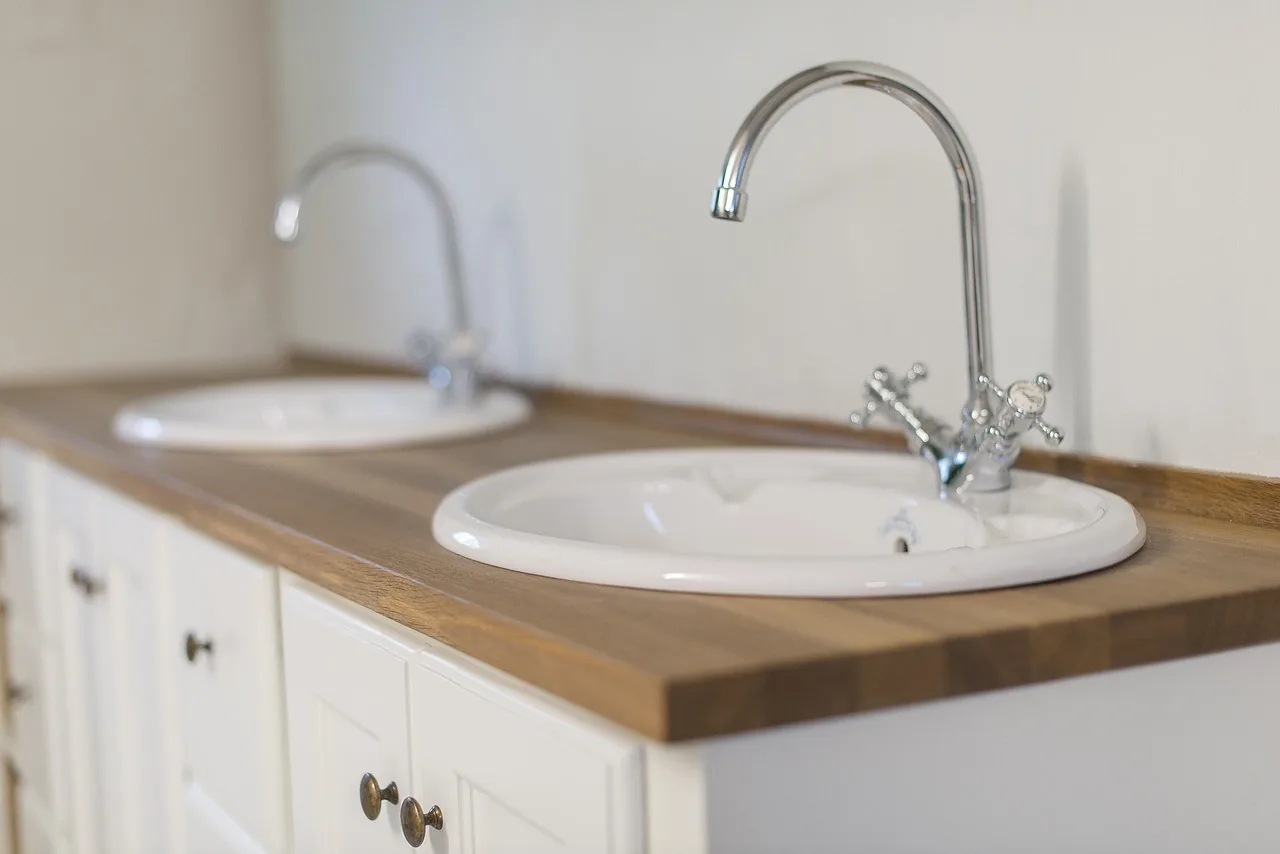 A clean bathroom vanity with a white basin