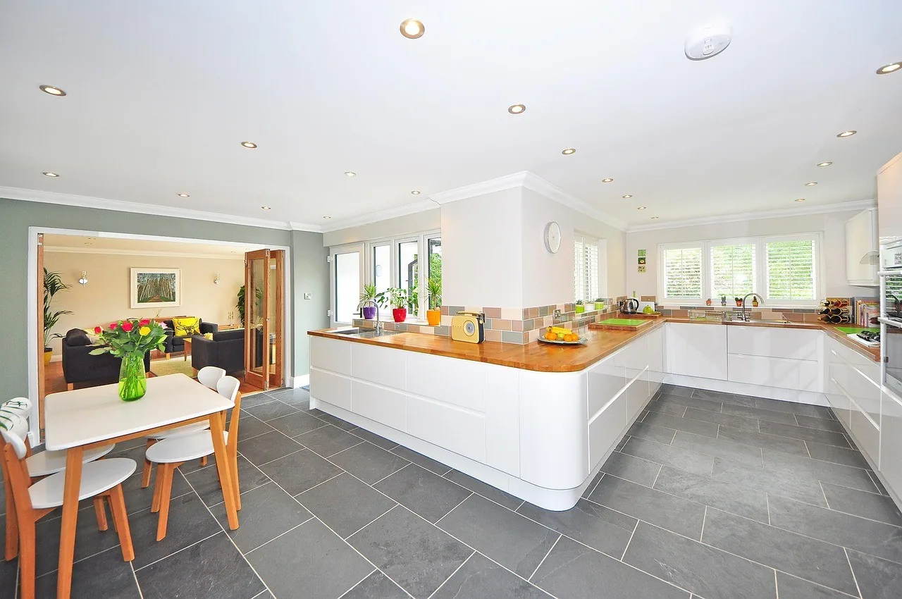 A bright, clean kitchen with white cupboards